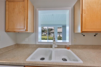 Located on a quiet cul-de-sac and just steps from the covered on Kings Point Executive Golf Course in Florida - for sale on GolfHomes.com, golf home, golf lot