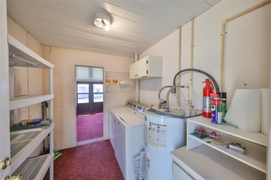 Located on a quiet cul-de-sac and just steps from the covered on Kings Point Executive Golf Course in Florida - for sale on GolfHomes.com, golf home, golf lot