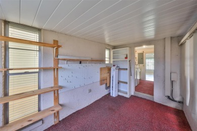 Located on a quiet cul-de-sac and just steps from the covered on Kings Point Executive Golf Course in Florida - for sale on GolfHomes.com, golf home, golf lot