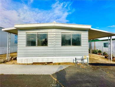 This charming 2 bedroom, 2 bathroom mobile home is located in on Hidden Springs Country Club in California - for sale on GolfHomes.com, golf home, golf lot