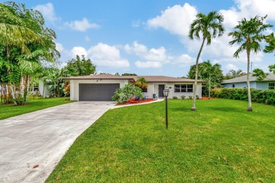 Discover this Delray Beach 4-bedroom, 2.5 bath pool home on Delray Beach Golf Club in Florida - for sale on GolfHomes.com, golf home, golf lot