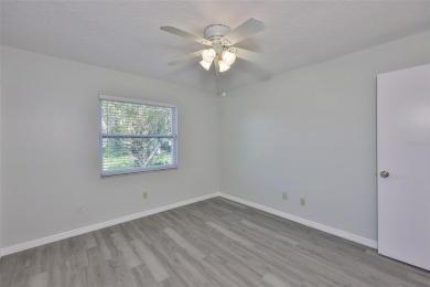 Located on a quiet cul-de-sac and just steps from the covered on Kings Point Executive Golf Course in Florida - for sale on GolfHomes.com, golf home, golf lot