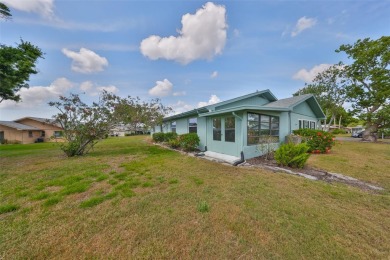 Located on a quiet cul-de-sac and just steps from the covered on Kings Point Executive Golf Course in Florida - for sale on GolfHomes.com, golf home, golf lot