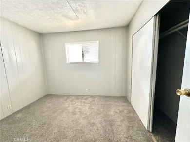 This charming 2 bedroom, 2 bathroom mobile home is located in on Hidden Springs Country Club in California - for sale on GolfHomes.com, golf home, golf lot