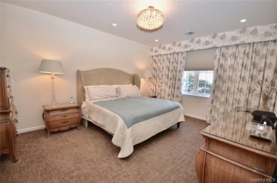 Immaculate Medici Model 2-bedroom, 2.5-bath (Primary on the on The Greens At Half Hollow in New York - for sale on GolfHomes.com, golf home, golf lot