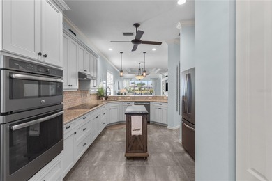 Maintenance-Free Patio Home with Lake View in St. Andrews East on Plantation Golf and Country Club in Florida - for sale on GolfHomes.com, golf home, golf lot