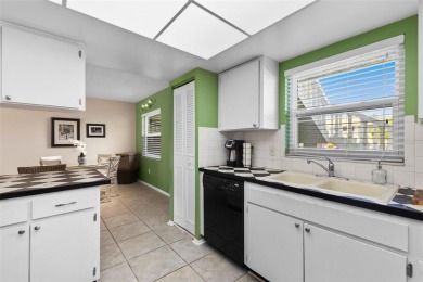Experience easy Florida living in this bright and spacious on Tarpon Springs Golf Course in Florida - for sale on GolfHomes.com, golf home, golf lot