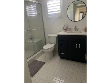 This spacious corner unit condo features 2 bedroom, 2 bath & a on Woodmont Country Club in Florida - for sale on GolfHomes.com, golf home, golf lot