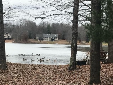 Rare Find!  Over 1 acre + 200' Waterfrontage on Fawn Lake on Canadian Lakes Country Club-The Royal Course in Michigan - for sale on GolfHomes.com, golf home, golf lot