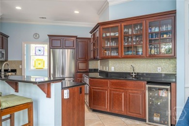 Located only a minute from the Oakridge gate, this custom stucco on The Landings Club - Marshwood in Georgia - for sale on GolfHomes.com, golf home, golf lot