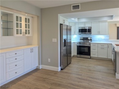 Discover the newest first-floor renovation in the sought-after on Hideaway Country Club in Florida - for sale on GolfHomes.com, golf home, golf lot