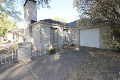 Elegant Brick Ranch Home situated on the Number Six Fairway of on Spencer Golf and Country Club in Iowa - for sale on GolfHomes.com, golf home, golf lot