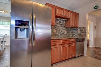 Welcome To This Charming 2 Bedroom 2 Bath Single-Family Home In on Mainlands Golf Club in Florida - for sale on GolfHomes.com, golf home, golf lot