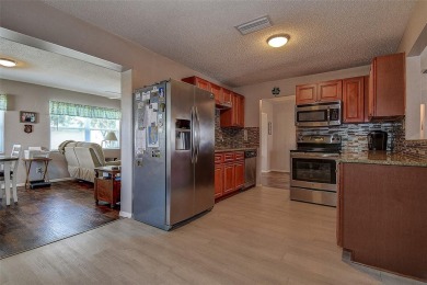 Welcome To This Charming 2 Bedroom 2 Bath Single-Family Home In on Mainlands Golf Club in Florida - for sale on GolfHomes.com, golf home, golf lot