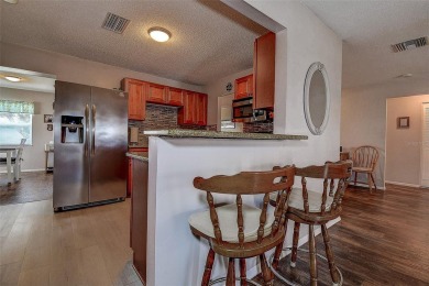 Welcome To This Charming 2 Bedroom 2 Bath Single-Family Home In on Mainlands Golf Club in Florida - for sale on GolfHomes.com, golf home, golf lot