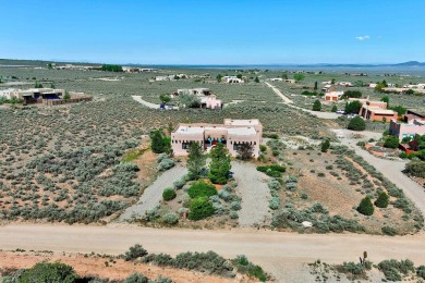 Discover the perfect blend of Southwestern charm and modern on Taos Country Club in New Mexico - for sale on GolfHomes.com, golf home, golf lot