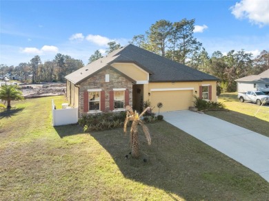 This exquisite 4-bedroom, 3-bathroom home in Oak Village of on Sugarmill Woods Golf and Country Club in Florida - for sale on GolfHomes.com, golf home, golf lot