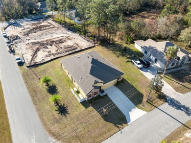 This exquisite 4-bedroom, 3-bathroom home in Oak Village of on Sugarmill Woods Golf and Country Club in Florida - for sale on GolfHomes.com, golf home, golf lot