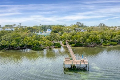 Welcome to a beautiful hidden gem of tropical paradise on on Longboat Key Golf Club in Florida - for sale on GolfHomes.com, golf home, golf lot