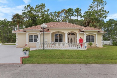 This beautifully designed concrete block stucco home stands out on The Grand Club Cypress Course in Florida - for sale on GolfHomes.com, golf home, golf lot