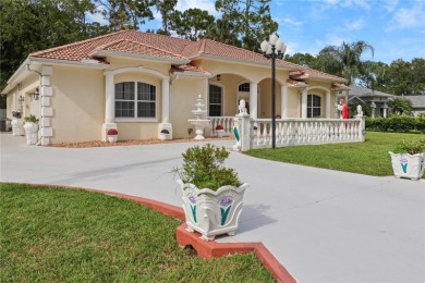 This beautifully designed concrete block stucco home stands out on The Grand Club Cypress Course in Florida - for sale on GolfHomes.com, golf home, golf lot