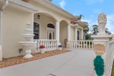 This beautifully designed concrete block stucco home stands out on The Grand Club Cypress Course in Florida - for sale on GolfHomes.com, golf home, golf lot