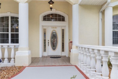 This beautifully designed concrete block stucco home stands out on The Grand Club Cypress Course in Florida - for sale on GolfHomes.com, golf home, golf lot