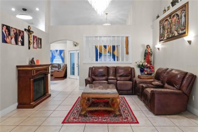 This beautifully designed concrete block stucco home stands out on The Grand Club Cypress Course in Florida - for sale on GolfHomes.com, golf home, golf lot