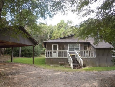 Remarkable 3-2 home situated on three lots, combined for a total on Holly Lake Ranch Golf Club in Texas - for sale on GolfHomes.com, golf home, golf lot