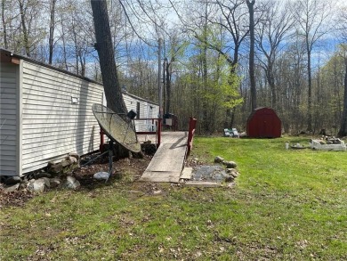 2 lots, nice location! 2 bedroom, 1 bath mobile home selling *AS on Hardwoods Golf Club At Mille Lacs in Minnesota - for sale on GolfHomes.com, golf home, golf lot