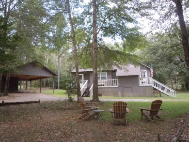 Remarkable 3-2 home situated on three lots, combined for a total on Holly Lake Ranch Golf Club in Texas - for sale on GolfHomes.com, golf home, golf lot