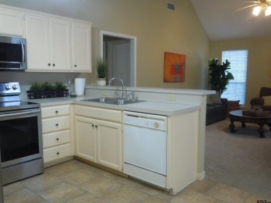 Remarkable 3-2 home situated on three lots, combined for a total on Holly Lake Ranch Golf Club in Texas - for sale on GolfHomes.com, golf home, golf lot