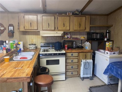 2 lots, nice location! 2 bedroom, 1 bath mobile home selling *AS on Hardwoods Golf Club At Mille Lacs in Minnesota - for sale on GolfHomes.com, golf home, golf lot
