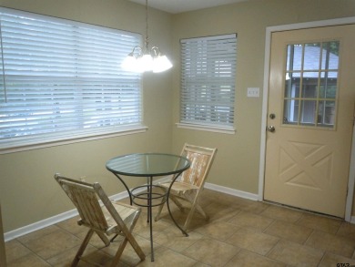 Remarkable 3-2 home situated on three lots, combined for a total on Holly Lake Ranch Golf Club in Texas - for sale on GolfHomes.com, golf home, golf lot