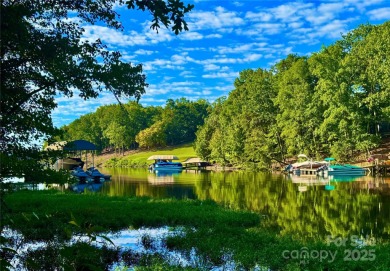 Beautiful lake front nearly flat lot located in the Long Cove on Old North State Club at Uwharrie Point Golf community in North Carolina - for sale on GolfHomes.com, golf home, golf lot