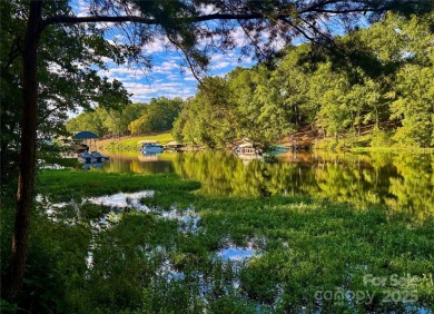 Beautiful lake front nearly flat lot located in the Long Cove on Old North State Club at Uwharrie Point Golf community in North Carolina - for sale on GolfHomes.com, golf home, golf lot