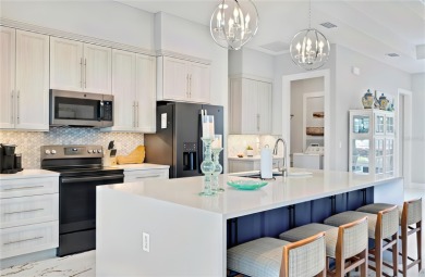 The ultimate saltwater lifestyle awaits in this like-new 2021 on Palm Harbor Golf Club in Florida - for sale on GolfHomes.com, golf home, golf lot