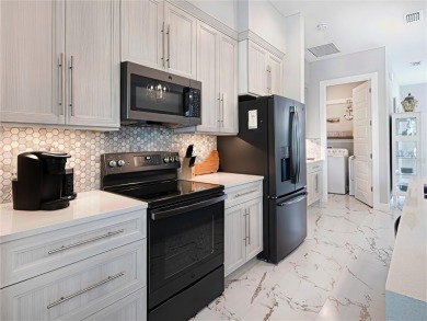 The ultimate saltwater lifestyle awaits in this like-new 2021 on Palm Harbor Golf Club in Florida - for sale on GolfHomes.com, golf home, golf lot
