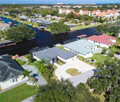 The ultimate saltwater lifestyle awaits in this like-new 2021 on Palm Harbor Golf Club in Florida - for sale on GolfHomes.com, golf home, golf lot