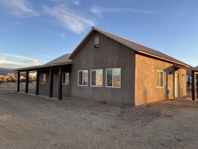 This beautiful home in the Vista Linda area With a 2 minute on Taos Country Club in New Mexico - for sale on GolfHomes.com, golf home, golf lot