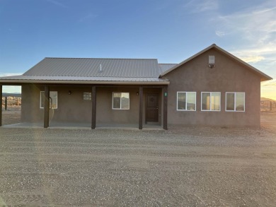 This beautiful home in the Vista Linda area With a 2 minute on Taos Country Club in New Mexico - for sale on GolfHomes.com, golf home, golf lot