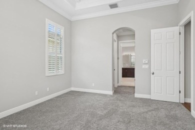 Nestled within the secured, resort-style gates of PGA Village on  in Florida - for sale on GolfHomes.com, golf home, golf lot
