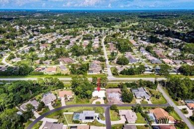 Discover the charm of 57 Woodhollow Dr, a stunning custom-built on The Grand Club - Pine Lakes Course in Florida - for sale on GolfHomes.com, golf home, golf lot