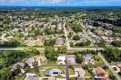Discover the charm of 57 Woodhollow Dr, a stunning custom-built on The Grand Club - Pine Lakes Course in Florida - for sale on GolfHomes.com, golf home, golf lot