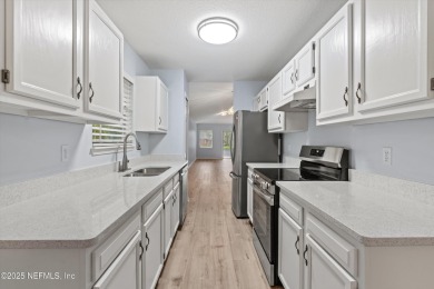 Welcome to this elegantly renovated 2-bedroom, 2-bath home on Julington Creek Golf Club in Florida - for sale on GolfHomes.com, golf home, golf lot