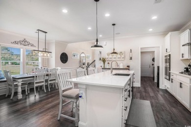 Stunning and beautifully appointed, this 3,431 heated square on Wild Wing Plantation in South Carolina - for sale on GolfHomes.com, golf home, golf lot