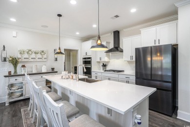 Stunning and beautifully appointed, this 3,431 heated square on Wild Wing Plantation in South Carolina - for sale on GolfHomes.com, golf home, golf lot