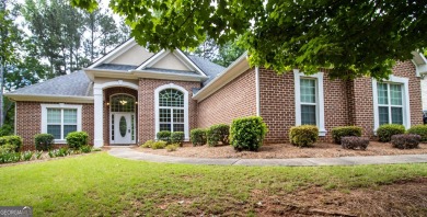 Gorgeous, all-brick, ranch home with side entry garage just on Canongate At Georgia National Golf Club in Georgia - for sale on GolfHomes.com, golf home, golf lot