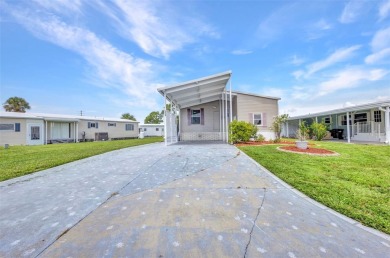 Welcome to 5748 Holiday Park Blvd.  This home is located in the on Sabal Trace Golf and Country Club in Florida - for sale on GolfHomes.com, golf home, golf lot