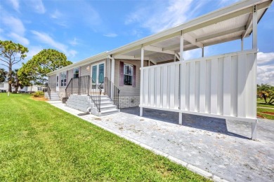 Welcome to 5748 Holiday Park Blvd.  This home is located in the on Sabal Trace Golf and Country Club in Florida - for sale on GolfHomes.com, golf home, golf lot